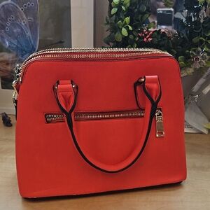 Chic Red Handbag with Gold Accents